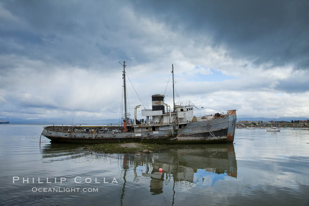 Dilapitated old wooden boat in Ushuaia harbor