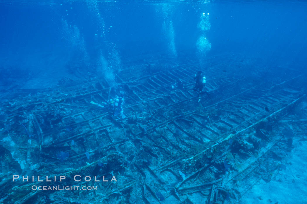 Divers swim over a undersea wreck. Bahamas, natural history stock photograph, photo id 00695