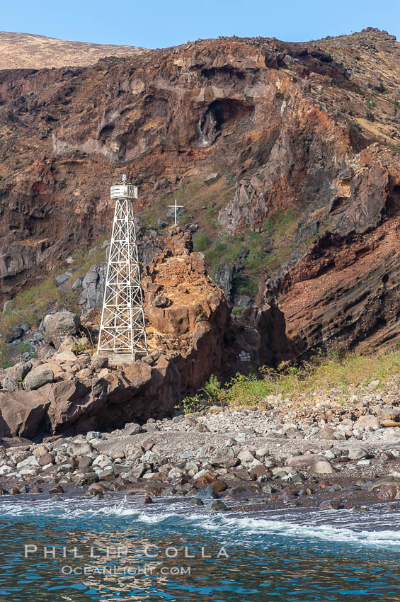 Lighthouse and cross mark the site of a small fishing shack and old chapel and prison near the north end of Guadalupe Island (Isla Guadalupe). Baja California, Mexico, natural history stock photograph, photo id 09732