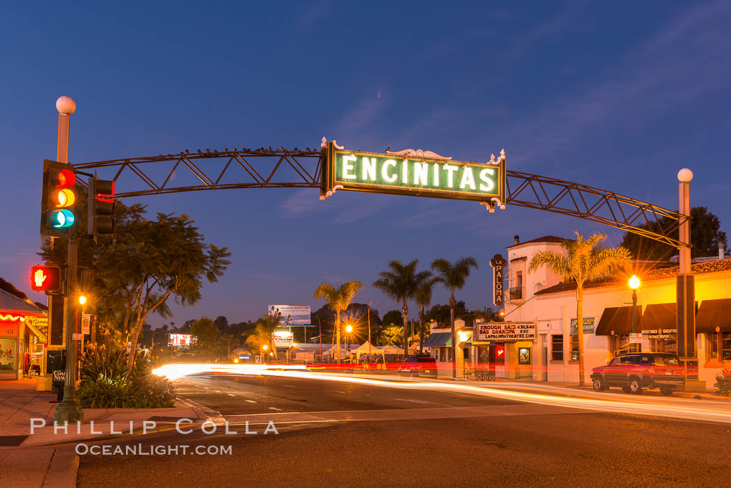 Encinitas city sign lit at night over Highway 101