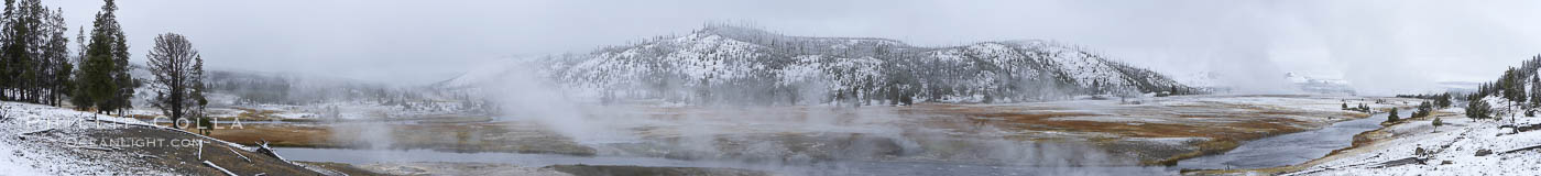 Firehole River, natural hot spring water steaming in cold winter air, panorama, Midway Geyser Basin, Yellowstone National Park, Wyoming
