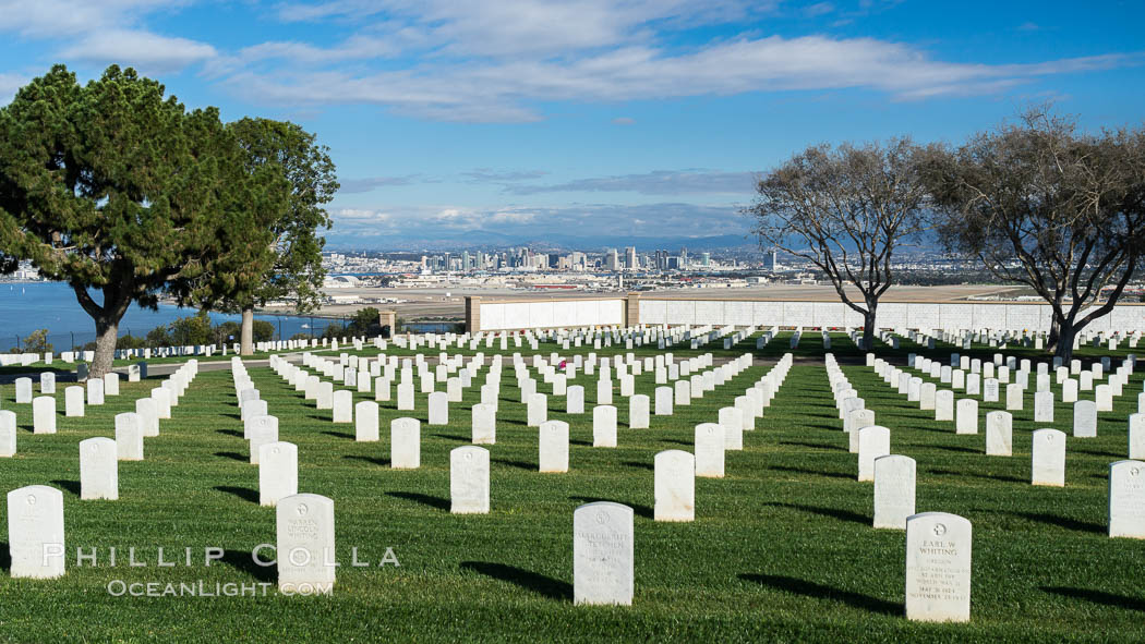 Tombstones at Fort Rosecrans National Cemetery, with downtown San Diego in the distance. California, USA, natural history stock photograph, photo id 30200