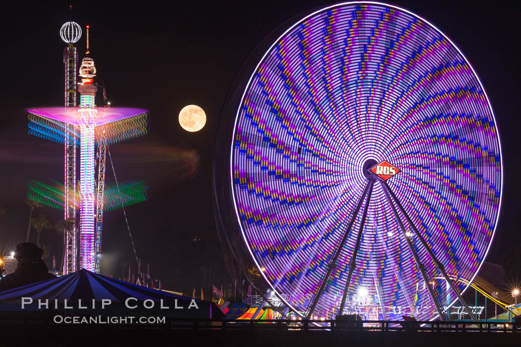 Full moon rising at night over the San Diego County Fair.  Del Mar Fair at night