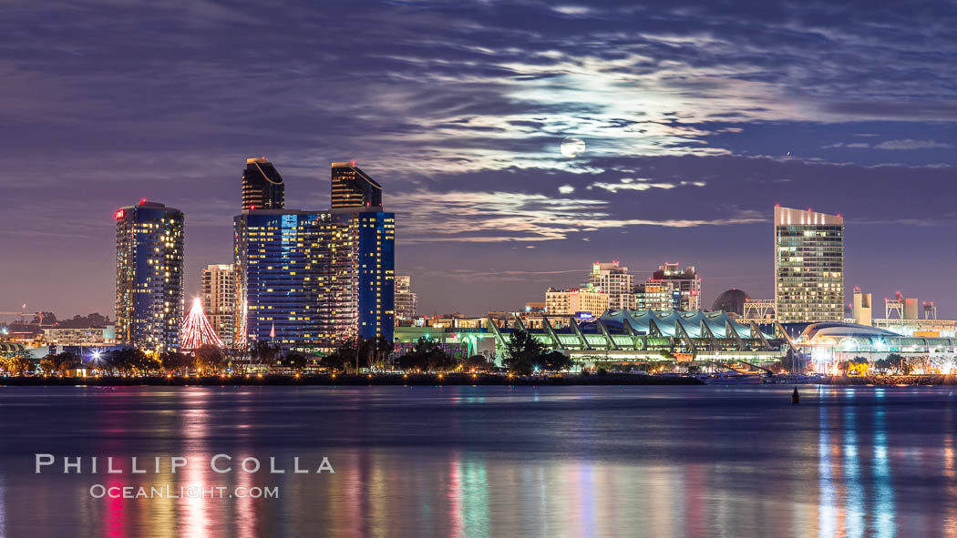 Full moon rising over San Diego city skyline, sunset, storm clouds, viewed from Coronado Island. California, USA, natural history stock photograph, photo id 28025