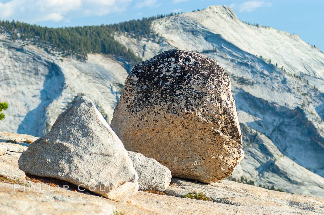 Glacial erratics atop Olmsted Point, with Clouds Rest in the background. Erratics are huge boulders left behind by the passing of glaciers which carved the granite surroundings into their present-day form, Yosemite National Park, California