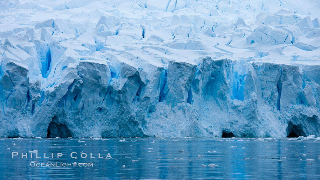 A glacier fractures and cracks, as the leading of a glacier fractures and cracks as it reaches the ocean.  The pieces will float away to become icebergs. Neko Harbor, Antarctic Peninsula, Antarctica, natural history stock photograph, photo id 25671