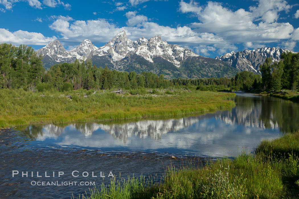 The Grand Tetons, reflected in the glassy waters of the Snake River at Schwabacher Landing, on a beautiful summer morning. Grand Teton National Park, Wyoming, USA, natural history stock photograph, photo id 26934