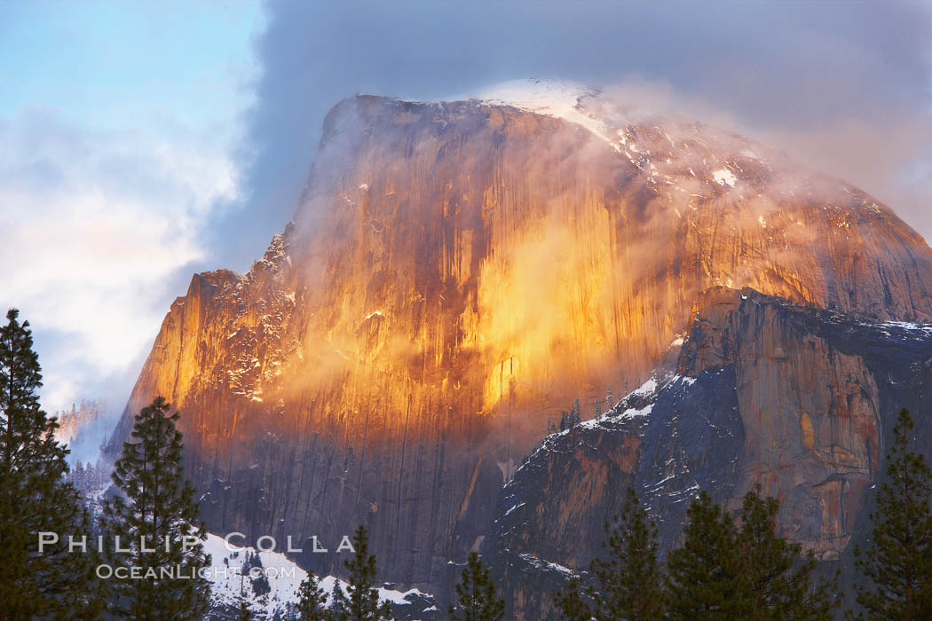 Half Dome and storm clouds at sunset, viewed from Sentinel Bridge, Yosemite National Park, California