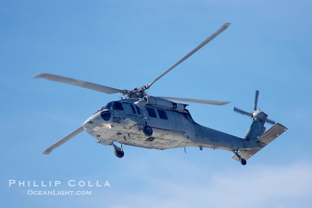 Helicopter circles over Swamis keeping an eye on surfers.  Giant surf and big waves nail Southern California, December 21, 2005., natural history stock photograph, photo id 14842