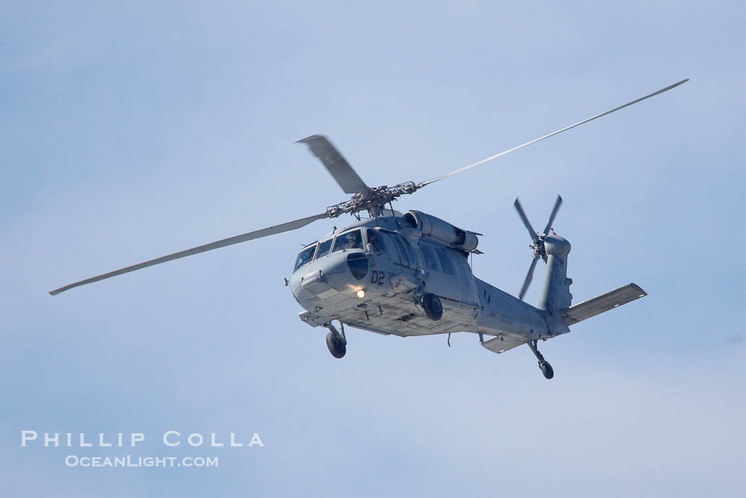 Helicopter circles over Swamis keeping an eye on surfers.  Giant surf and big waves nail Southern California, December 21, 2005., natural history stock photograph, photo id 14841