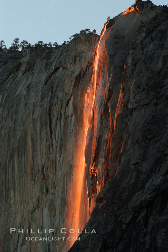 Horsetail Falls backlit by the setting sun as it cascades down the face of El Capitan, February, Yosemite Valley. Yosemite National Park, California, USA, natural history stock photograph, photo id 06996