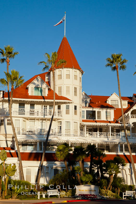 Hotel del Coronado, known affectionately as the Hotel Del. It was once the largest hotel in the world, and is one of the few remaining wooden Victorian beach resorts. It sits on the beach on Coronado Island, seen here with downtown San Diego in the distance. It is widely considered to be one of Americas most beautiful and classic hotels. Built in 1888, it was designated a National Historic Landmark in 1977. California, USA, natural history stock photograph, photo id 27106