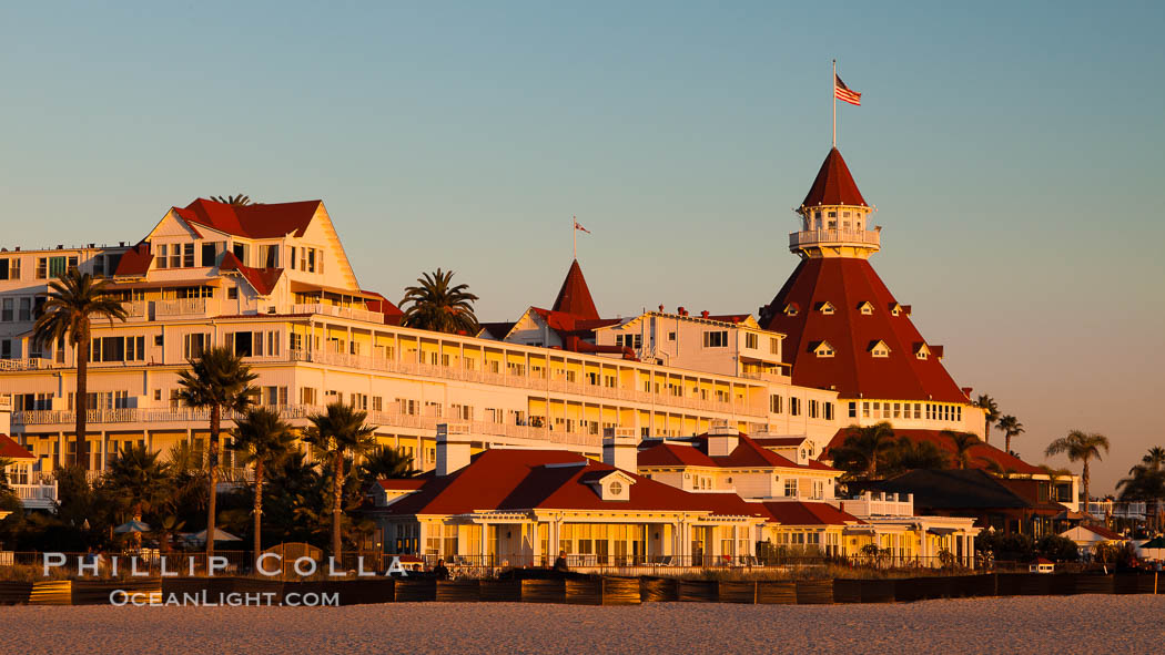 Hotel del Coronado, known affectionately as the Hotel Del. It was once the largest hotel in the world, and is one of the few remaining wooden Victorian beach resorts. It sits on the beach on Coronado Island, seen here with downtown San Diego in the distance. It is widely considered to be one of Americas most beautiful and classic hotels. Built in 1888, it was designated a National Historic Landmark in 1977. California, USA, natural history stock photograph, photo id 27395