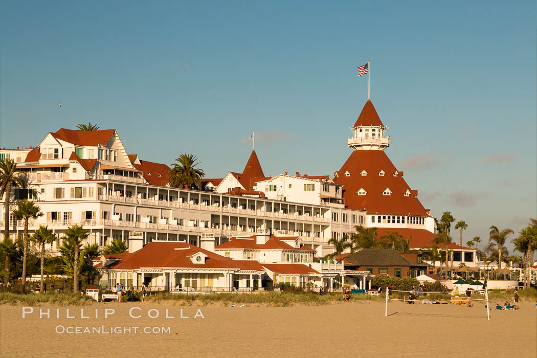 Hotel del Coronado, known affectionately as the Hotel Del. It was once the largest hotel in the world, and is one of the few remaining wooden Victorian beach resorts. It sits on the beach on Coronado Island, seen here with downtown San Diego in the distance. It is widely considered to be one of Americas most beautiful and classic hotels. Built in 1888, it was designated a National Historic Landmark in 1977. California, USA, natural history stock photograph, photo id 27887