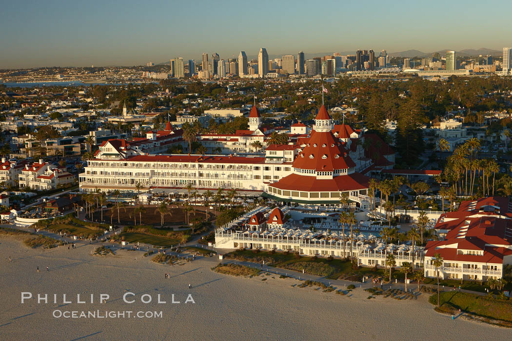 Hotel del Coronado, known affectionately as the Hotel Del.  It was once the largest hotel in the world, and is one of the few remaining wooden Victorian beach resorts.  It sits on the beach on Coronado Island, seen here with downtown San Diego in the distance.  It is widely considered to be one of Americas most beautiful and classic hotels. Built in 1888, it was designated a National Historic Landmark in 1977. California, USA, natural history stock photograph, photo id 22353
