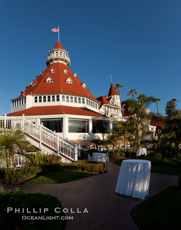 Hotel del Coronado, known affectionately as the Hotel Del. It was once the largest hotel in the world, and is one of the few remaining wooden Victorian beach resorts. It sits on the beach on Coronado Island, seen here with downtown San Diego in the distance. It is widely considered to be one of Americas most beautiful and classic hotels. Built in 1888, it was designated a National Historic Landmark in 1977., natural history stock photograph, photo id 27105