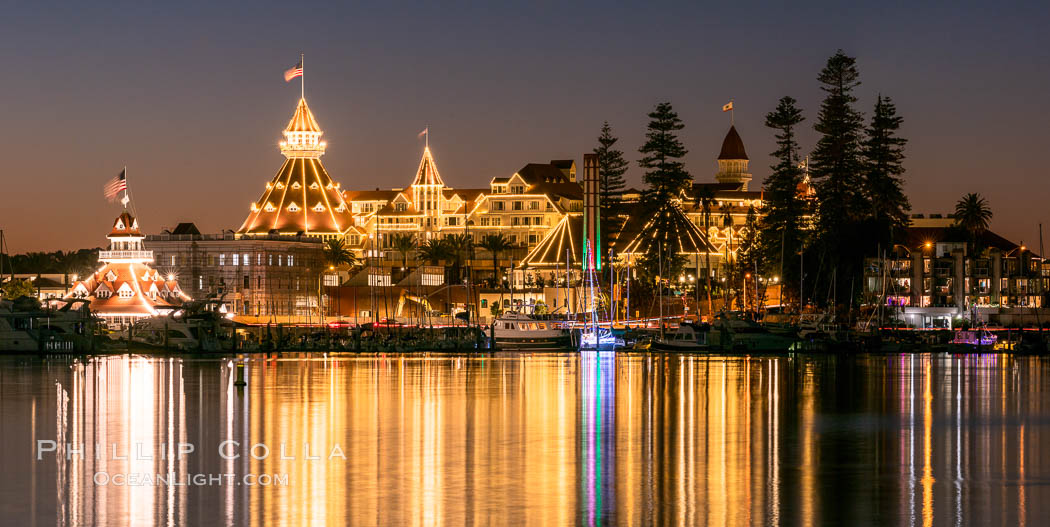 Hotel del Coronado with holiday Christmas night lights, known affectionately as the Hotel Del. It was once the largest hotel in the world, and is one of the few remaining wooden Victorian beach resorts.  The Hotel Del is widely considered to be one of Americas most beautiful and classic hotels. Built in 1888, it was designated a National Historic Landmark in 1977., natural history stock photograph, photo id 36621