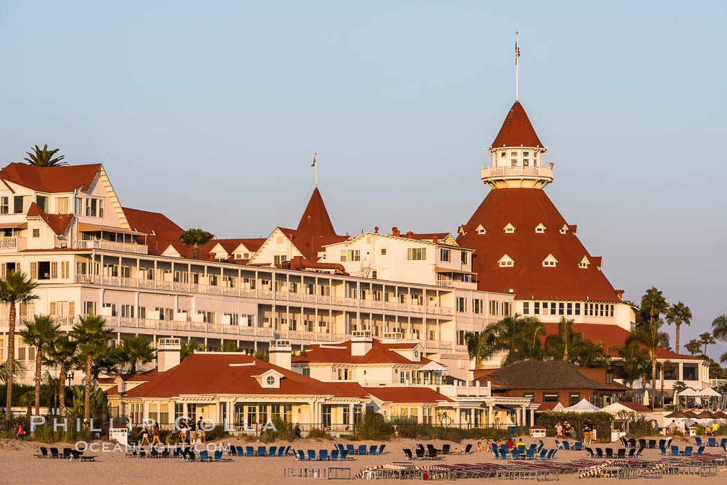 Hotel del Coronado, known affectionately as the Hotel Del. It was once the largest hotel in the world, and is one of the few remaining wooden Victorian beach resorts. It sits on the beach on Coronado Island, seen here with downtown San Diego in the distance. It is widely considered to be one of Americas most beautiful and classic hotels. Built in 1888, it was designated a National Historic Landmark in 1977. California, USA, natural history stock photograph, photo id 29419