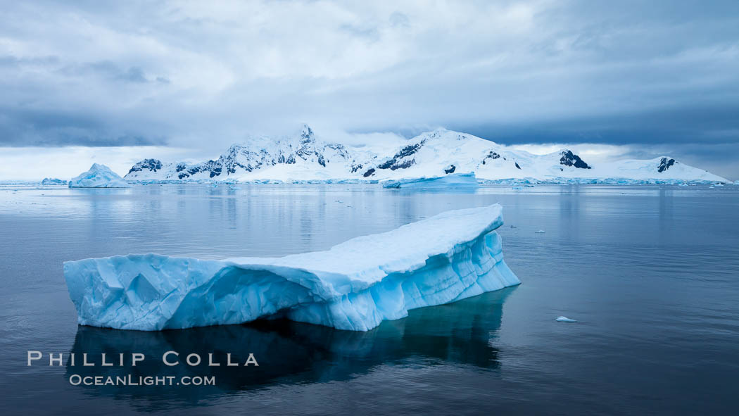 Iceberg and mountain panorama, cloudy morning. Paradise Bay, Antarctic Peninsula, Antarctica, natural history stock photograph, photo id 26381