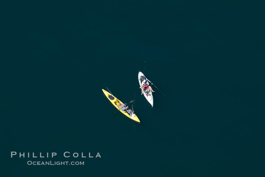 Kayak fishermen sitting still on the open ocean., natural history stock photograph, photo id 26037