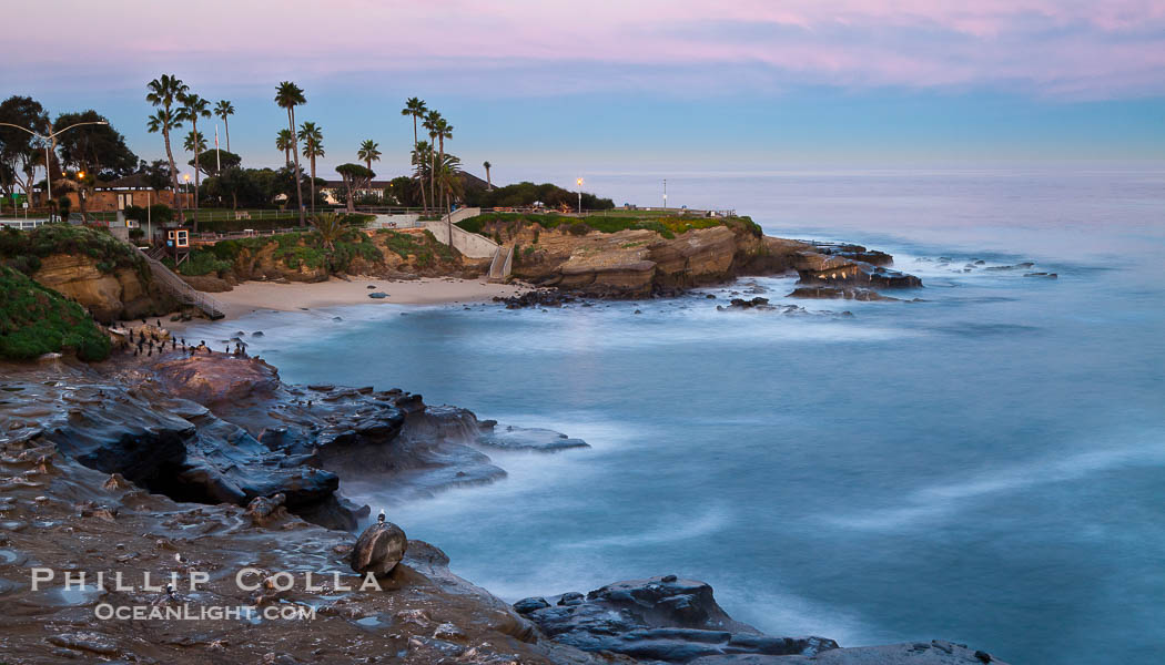 La Jolla Cove and earth shadow at dawn.  Just before sunrise the shadow of the Earth can seen as the darker sky below the pink sunrise., natural history stock photograph, photo id 26527