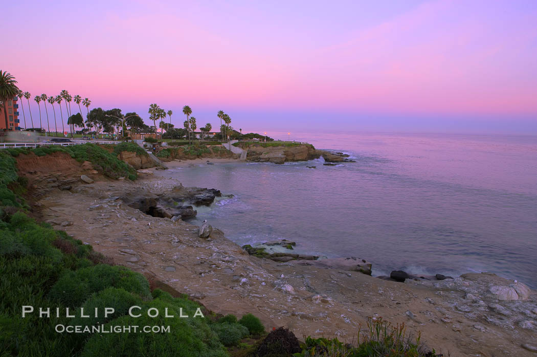 La Jolla Cove meets the dawn with pink skies and a flat ocean