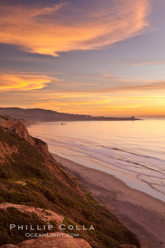 Sunset falls upon Torrey Pines State Reserve, viewed from the Torrey Pines glider port. La Jolla, Scripps Institution of Oceanography and Scripps Pier are seen in the distance