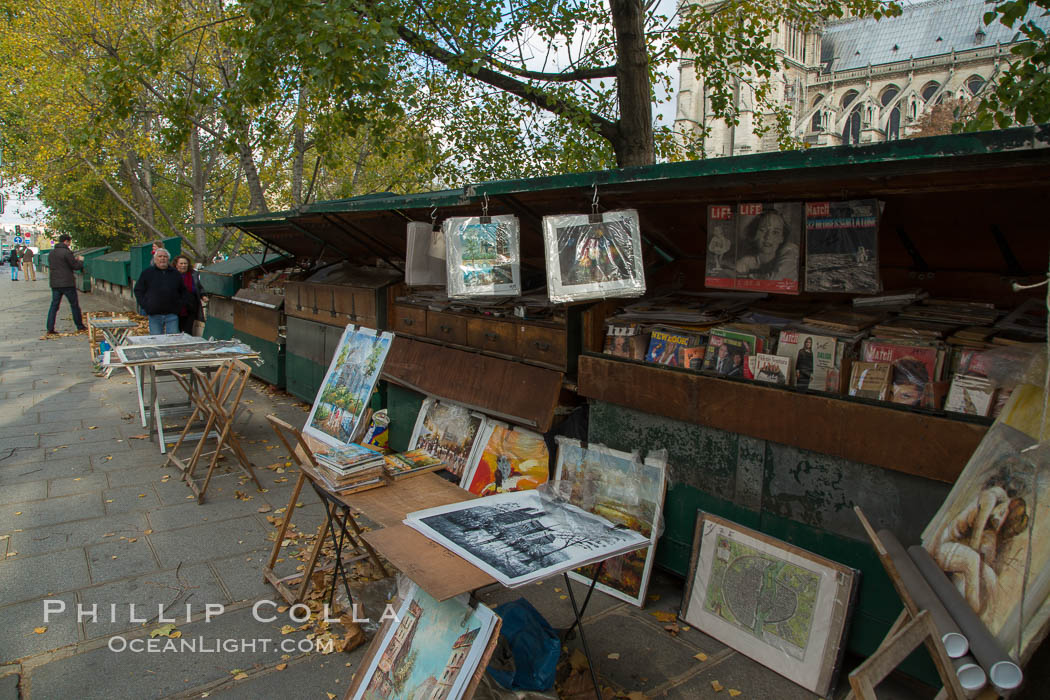 Art Seller along La Rive Gauche, the Left Bank, Paris. La Rive Gauch, the Left Bank, is the southern bank of the river Seine in Paris. Here the river flows roughly westward, cutting the city in two: looking downstream, the southern bank is to the left, and the northern bank (or Rive Droite) is to the right