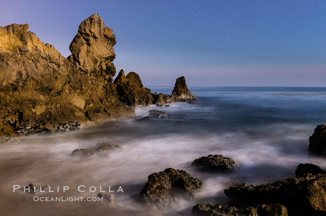 Little Corona Beach, at night under a full moon, waves lit by moonlight, Newport Beach, California