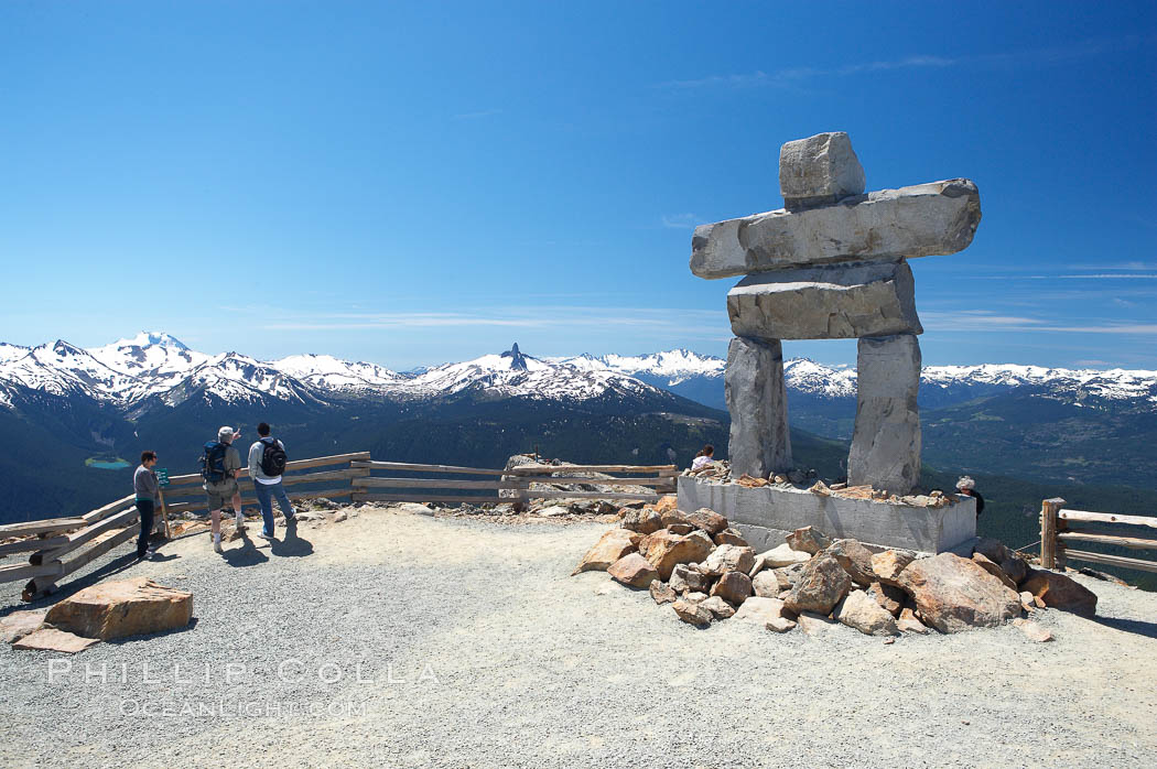 Ilanaaq, the logo of the 2010 Winter Olympics in Vancouver, is formed of stone in the Inukshuk-style of traditional Inuit sculpture.  This one is located on the summit of Whistler Mountain. British Columbia, Canada, natural history stock photograph, photo id 21018