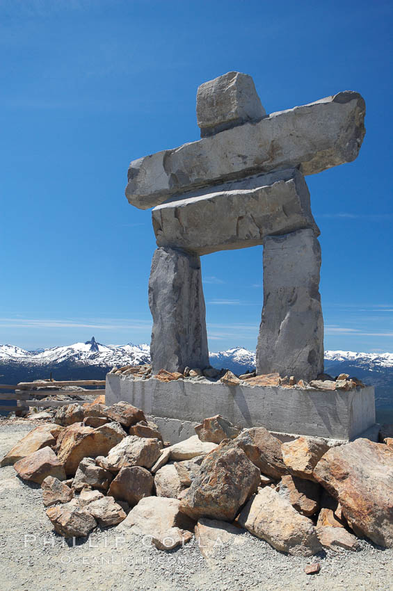 Ilanaaq, the logo of the 2010 Winter Olympics in Vancouver, is formed of stone in the Inukshuk-style of traditional Inuit sculpture.  This one is located on the summit of Whistler Mountain. British Columbia, Canada, natural history stock photograph, photo id 21016