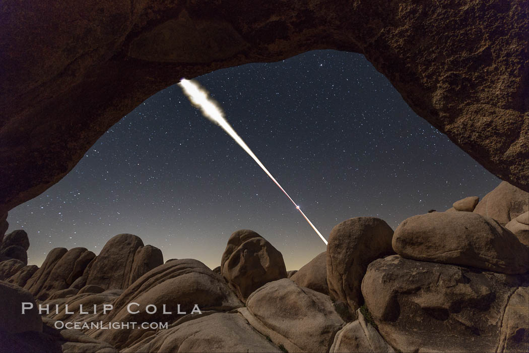 Lunar Eclipse Sequence, the path of the moon through the sky as it progresses from being fully visible (top) to fully eclipsed (middle) to almost fully visible again (bottom), viewed through Arch Rock, April 4 2015. Joshua Tree National Park, California, USA, natural history stock photograph, photo id 30713