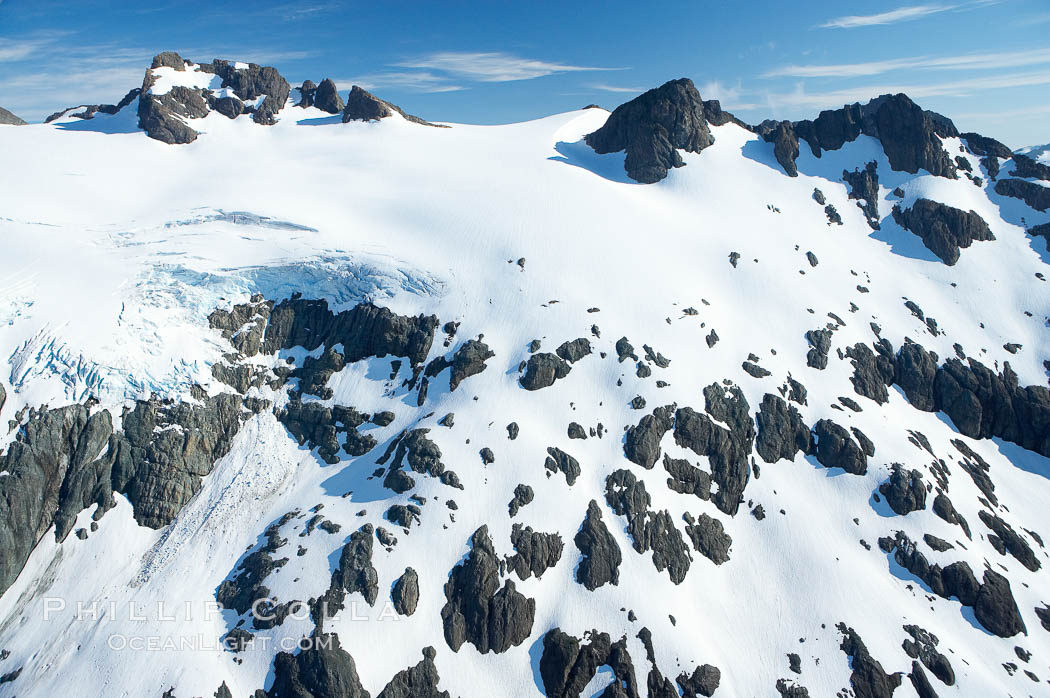 Glaciers on the summit of Mariner Mountain, on the west coast of Vancouver Island, British Columbia, Canada, part of Strathcona Provincial Park, located 36 km (22 mi) north of Tofino.  It is 1,771 m (5,810 ft) high and is snow covered year-round., natural history stock photograph, photo id 21119