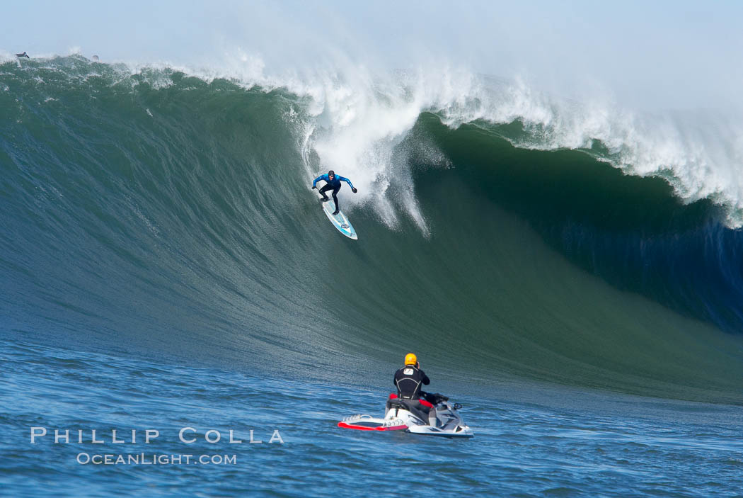 Grant Washburn (fifth place) gives the jetski photographer a show in the early rounds of the Mavericks surf contest, February 7, 2006. Half Moon Bay, California, USA, natural history stock photograph, photo id 15336