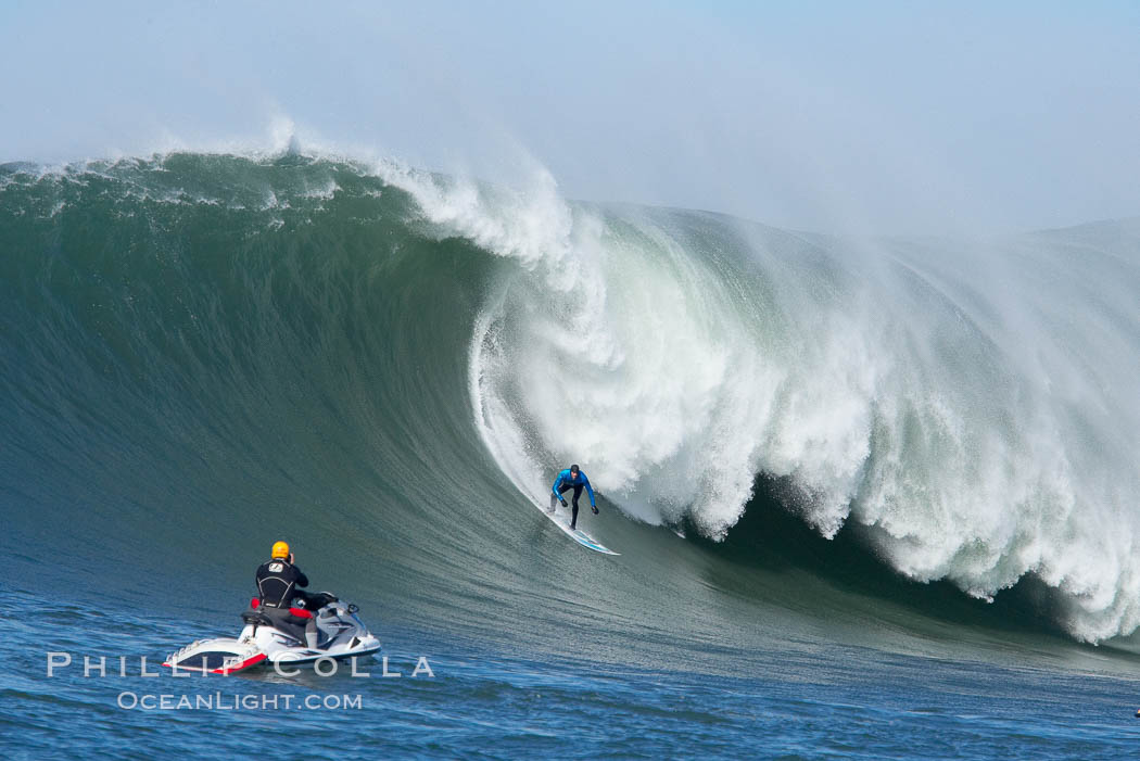 Grant Washburn (fifth place) gives the jetski photographer a show in the early rounds of the Mavericks surf contest, February 7, 2006. Half Moon Bay, California, USA, natural history stock photograph, photo id 15309