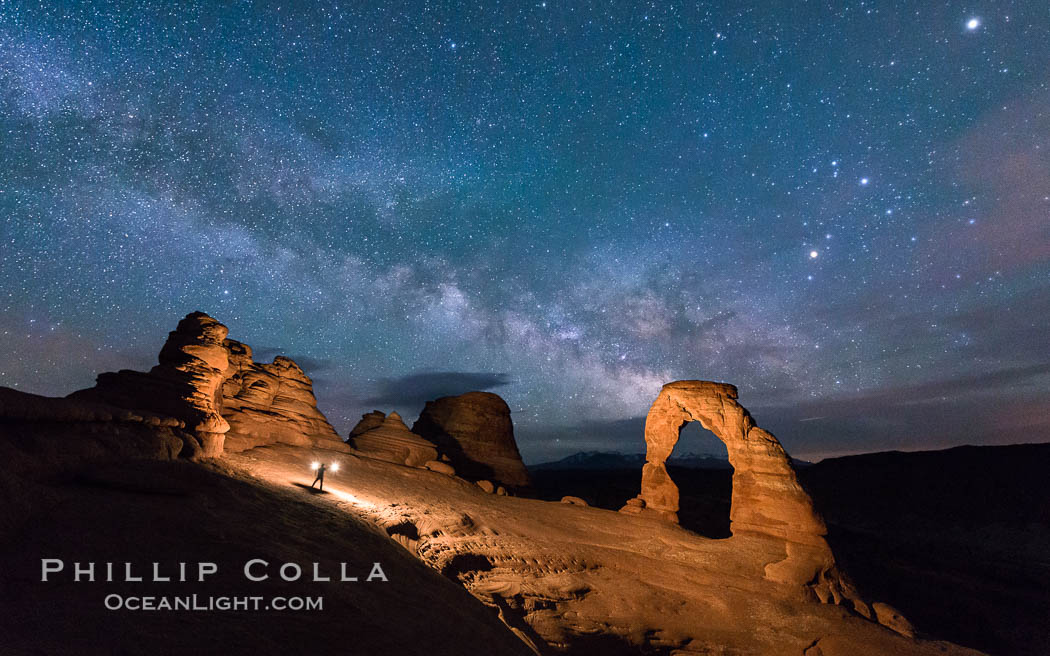 Light Painting and the Milky Way and Stars over Delicate Arch, at night, Arches National Park, Utah (Note: this image was created before a ban on light-painting in Arches National Park was put into effect.  Light-painting is no longer permitted in Arches National Park). USA, natural history stock photograph, photo id 29288