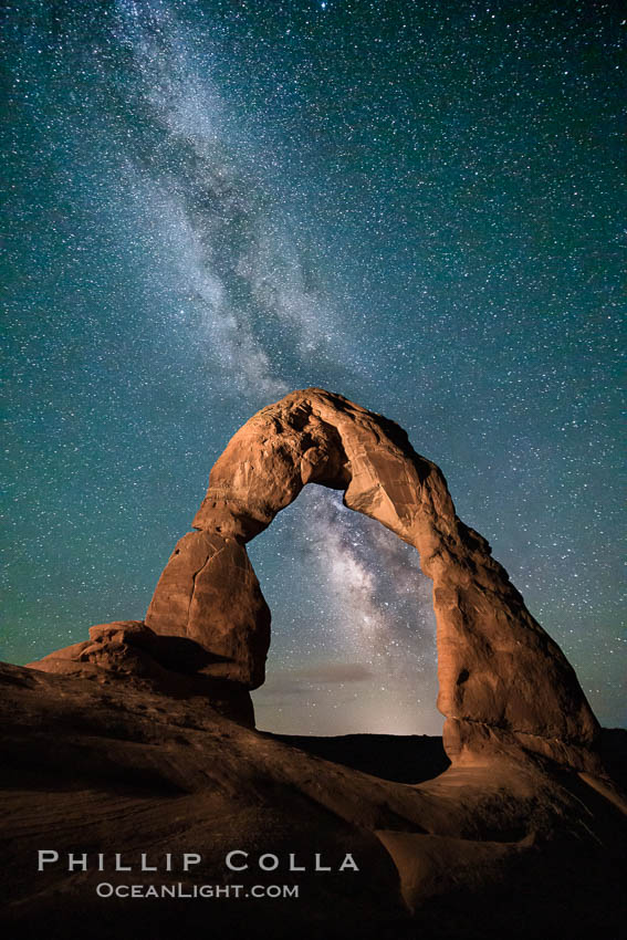 Milky Way arches over Delicate Arch, as stars cover the night sky, Arches National Park, Utah