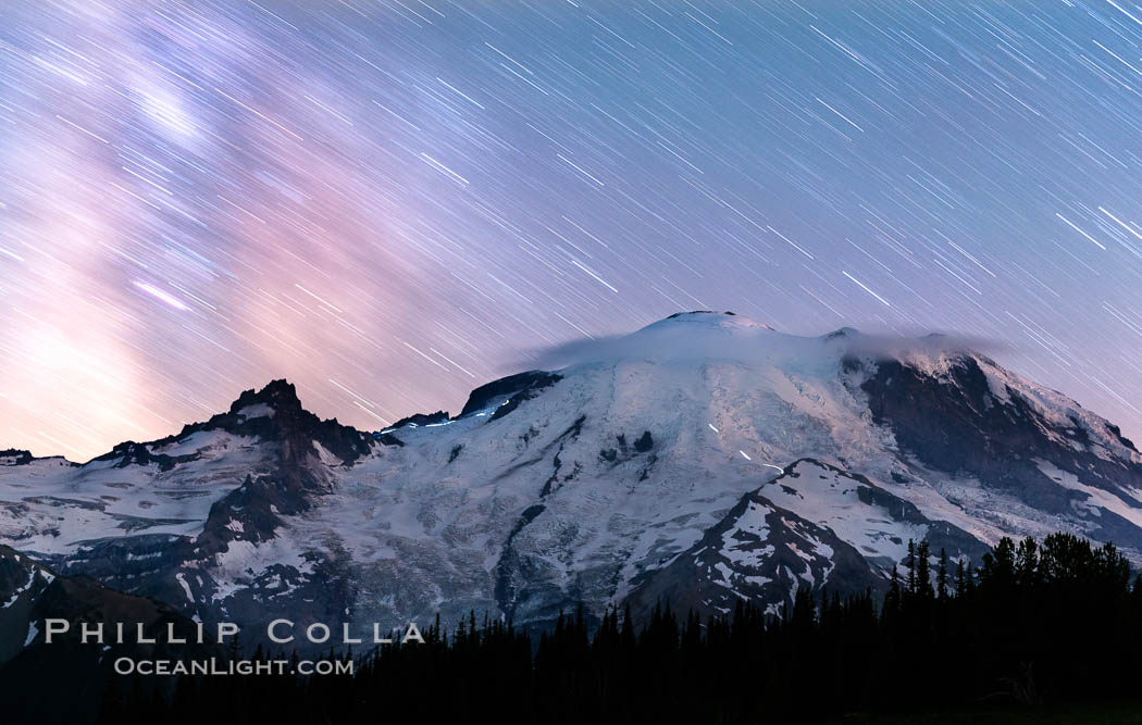 Moutain climbers light see upon Mount Rainier, Milky Way and stars at night above Mount Rainier, Sunrise, Mount Rainier National Park, Washington