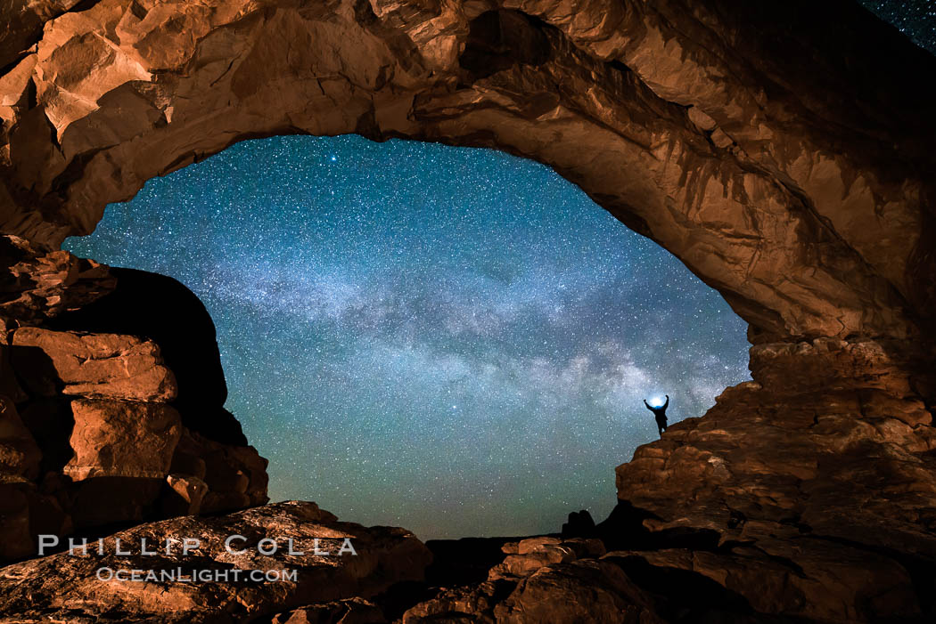 Hiker and Milky Way through North Window, Arches National Park. Utah, USA, natural history stock photograph, photo id 29278
