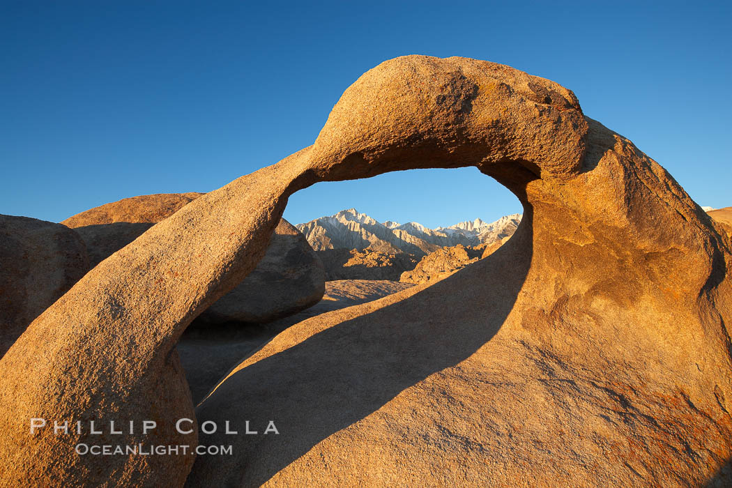 Mobius Arch in golden early morning light.  The natural stone arch is found in the scenic Alabama Hlls near Lone Pine, California. Alabama Hills Recreational Area, USA, natural history stock photograph, photo id 21731