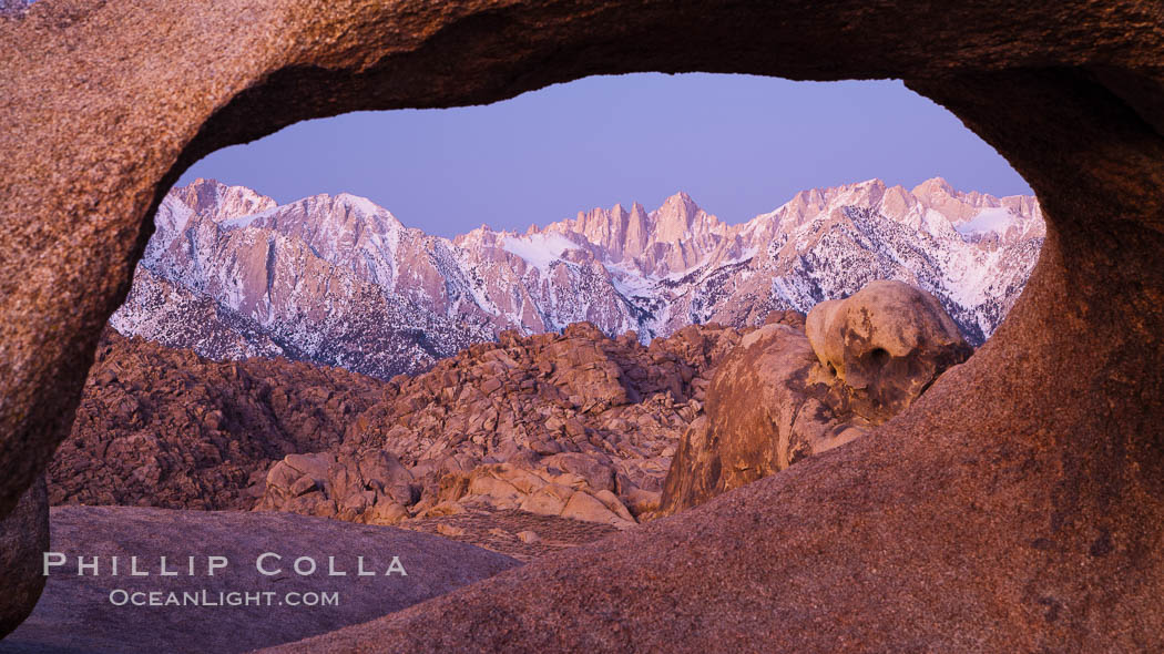 Mobius Arch at sunrise, framing snow dusted Lone Pine Peak and the Sierra Nevada Range in the background. Also known as Galen's Arch, Mobius Arch is found in the Alabama Hills Recreational Area near Lone Pine. California, USA, natural history stock photograph, photo id 27628