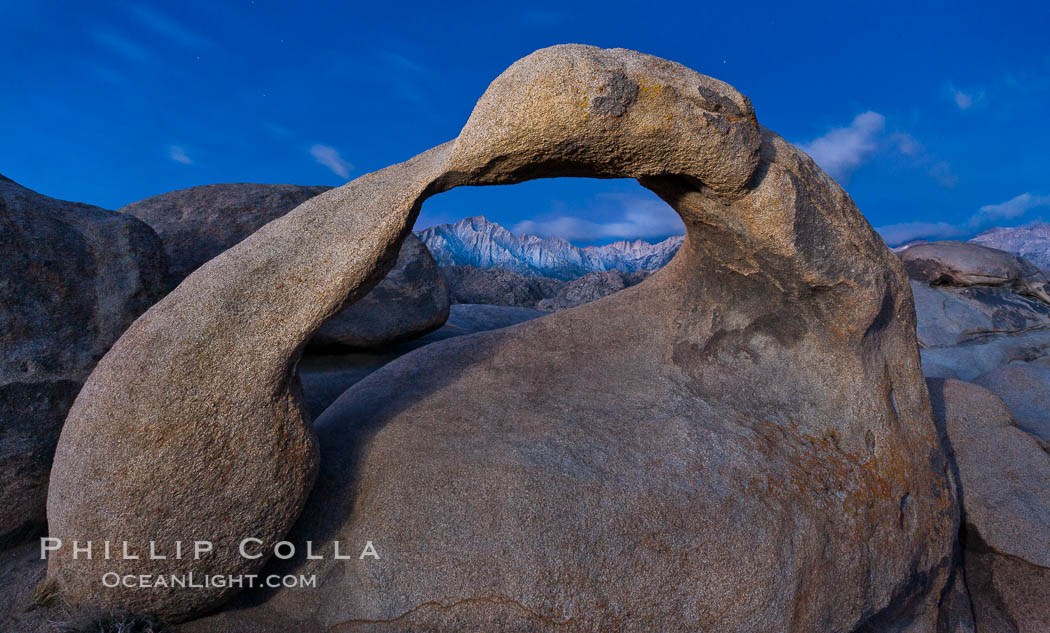 Mobius Arch at sunrise, framing snow dusted Lone Pine Peak and the Sierra Nevada Range in the background. Also known as Galen's Arch, Mobius Arch is found in the Alabama Hills Recreational Area near Lone Pine. California, USA, natural history stock photograph, photo id 27643