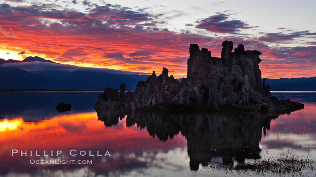 Mono Lake sunset, Sierra Nevada mountain range and tufas, clouds reflected in the still waters of Mono Lake. California, USA, natural history stock photograph, photo id 26978