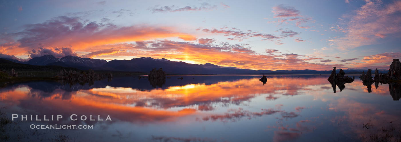 Sun pillar rises over the Sierra Nevada and this Mono Lake sunset, Sierra Nevada mountain range and tufas, clouds reflected in the still waters of Mono Lake. California, USA, natural history stock photograph, photo id 26968