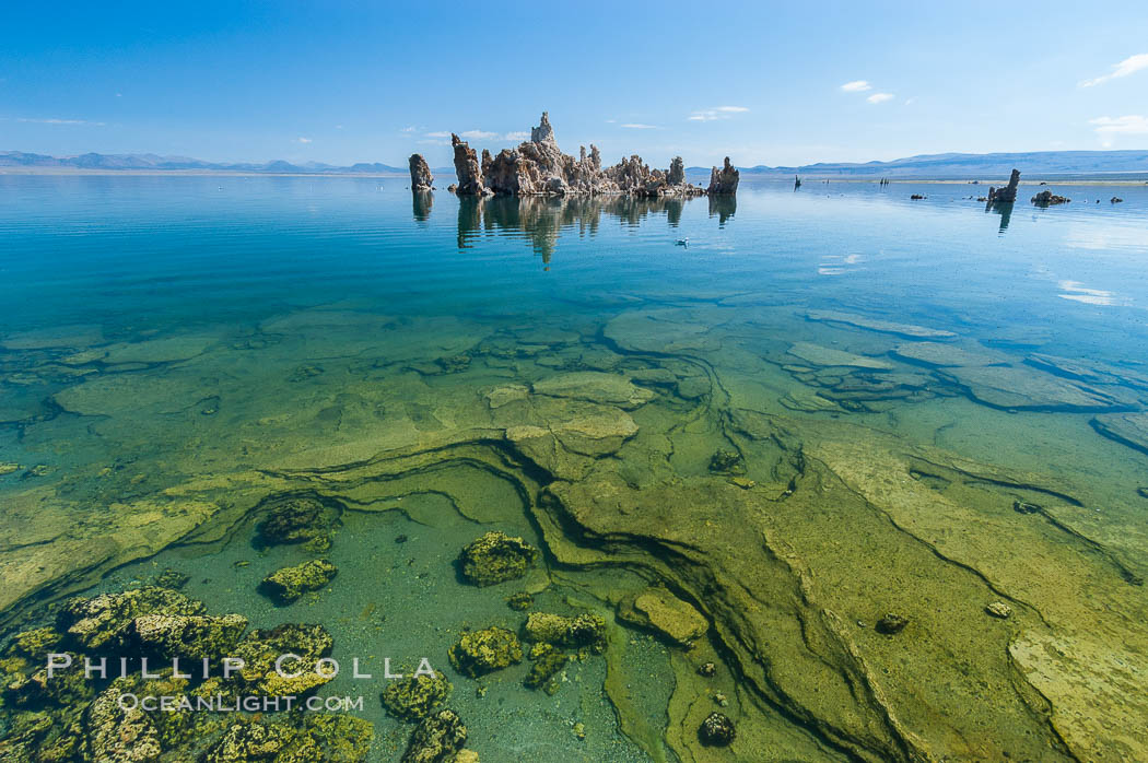 Tufa towers rise from Mono Lake.  Tufa towers are formed when underwater springs rich in calcium mix with lakewater rich in carbonates, forming calcium carbonate (limestone) structures below the surface of the lake.  The towers were eventually revealed when the water level in the lake was lowered starting in 1941.  South tufa grove, Navy Beach