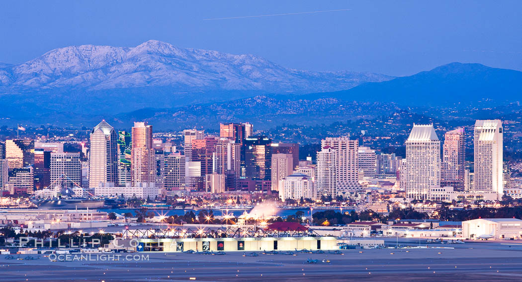 Dusk settles on downtown San Diego with snow-covered Mt. Laguna in the distance