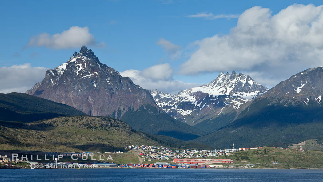 Mount Olivia (1318m) and the Five Brothers (Mount Cinco Hermanos, 1280m) in the Fuegian Andes rise above Ushuaia, the capital of the Tierra del Fuego region of Argentina.  The Beagle Channel fronts Ushuaia in the foreground., natural history stock photograph, photo id 23617