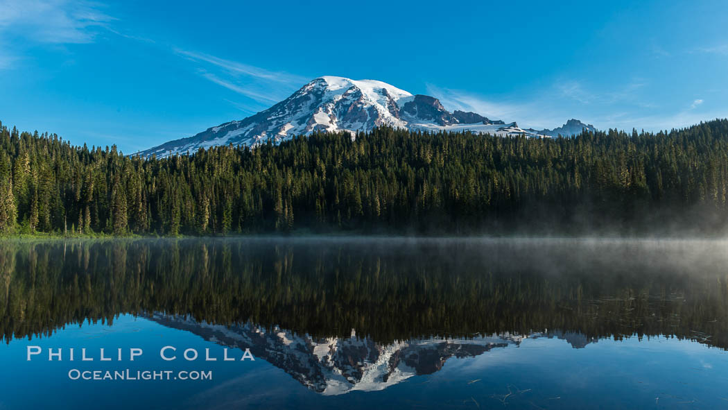 Mount Rainier is reflected in the calm waters of Reflection Lake, early morning, Mount Rainier National Park, Washington