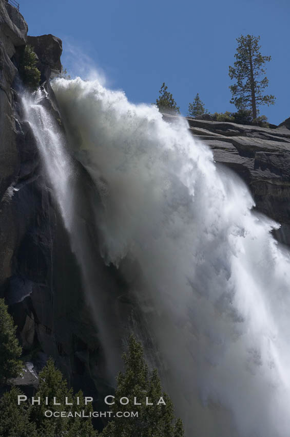 Nevada Falls marks where the Merced River plummets almost 600 through a joint in the Little Yosemite Valley, shooting out from a sheer granite cliff and then down to a boulder pile far below, Yosemite National Park, California