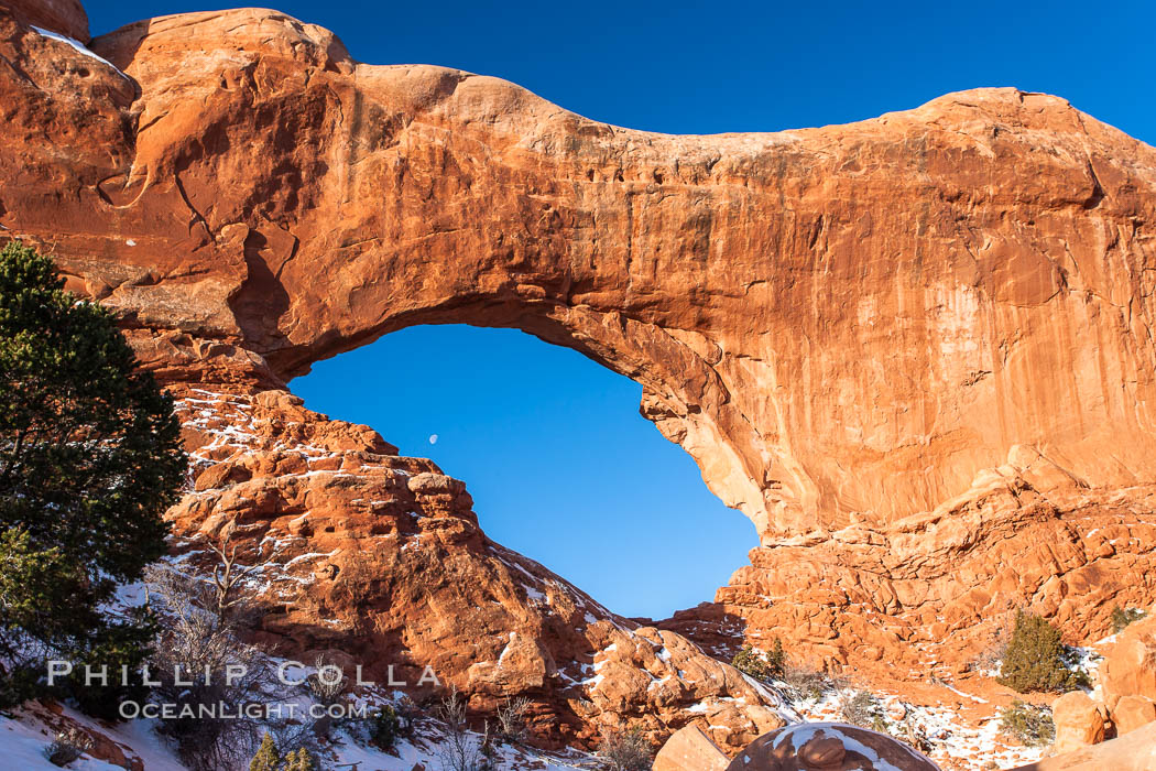 North Window, sunrise, eastern face.  North Window is a natural sandstone arch 90 feet wide and 48 feet high. Arches National Park, Utah, USA, natural history stock photograph, photo id 18162